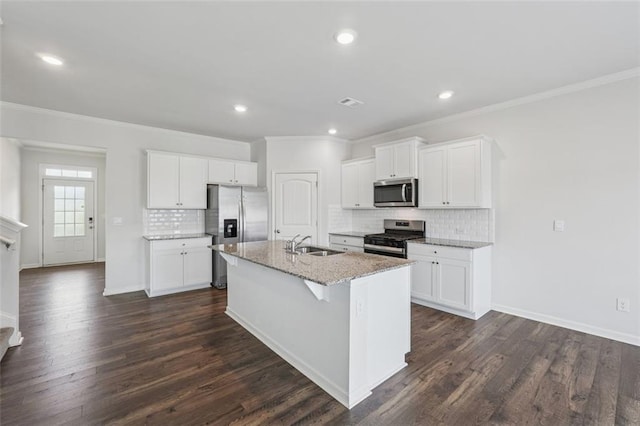 96 Quail Bend Way, Dallas, GA 30157 - kitchen featuring stainless steel appliances, a sink, crown molding, a kitchen island with sink, and tasteful backsplash