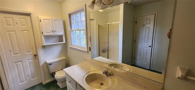 full bathroom with baseboards, vanity, toilet, and a shower stall