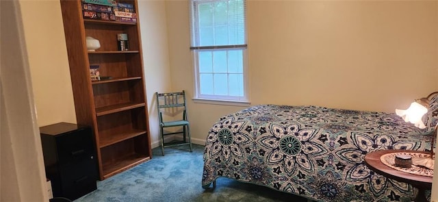 bedroom featuring carpet flooring and baseboards