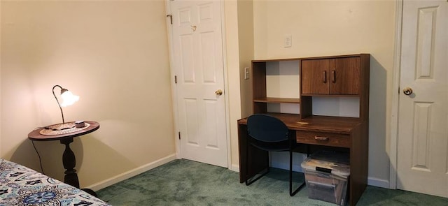 bedroom with dark colored carpet and baseboards