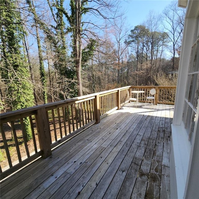 deck featuring a wooded view