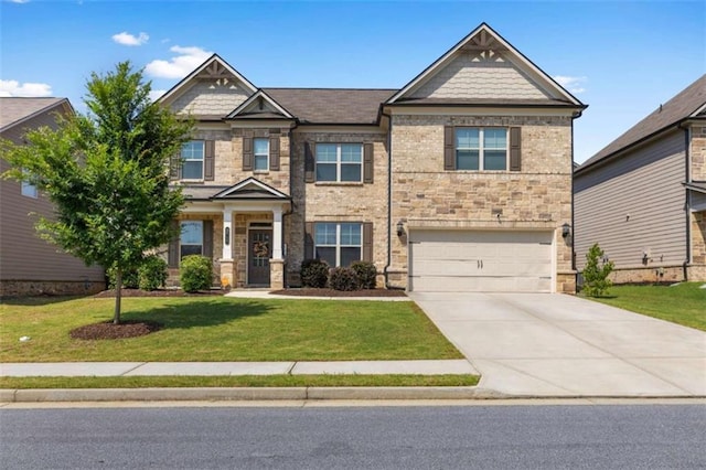 3717 Blue Goose Ln, Loganville, GA 30052 - craftsman house featuring stone siding, concrete driveway, a front lawn, and an attached garage