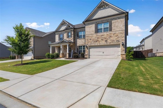 3717 Blue Goose Ln, Loganville, GA 30052 - craftsman house with stone siding, concrete driveway, and a garage