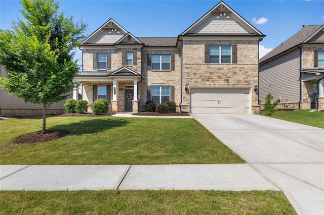 3717 Blue Goose Ln, Loganville, GA 30052 - craftsman-style house with a garage, driveway, a front lawn, and stone siding