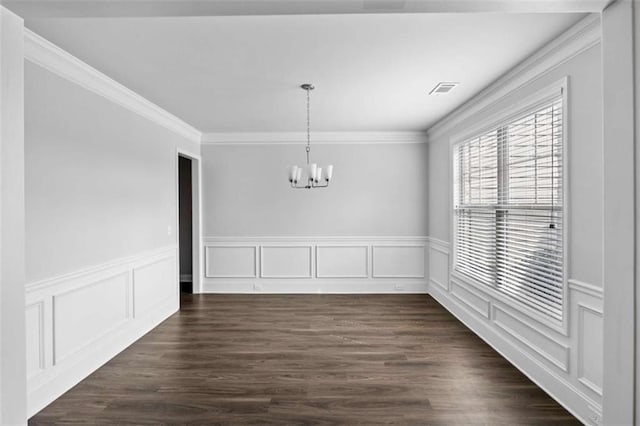 3717 Blue Goose Ln, Loganville, GA 30052 - unfurnished dining area with a chandelier, wainscoting, crown molding, a decorative wall, and dark wood-style floors
