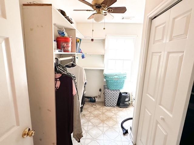 312 Henderson Mill Rd, Mansfield, GA 30055 - washroom featuring visible vents, light floors, and a ceiling fan