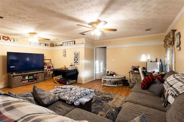 312 Henderson Mill Rd, Mansfield, GA 30055 - living room with visible vents, ornamental molding, ceiling fan, and wood finished floors