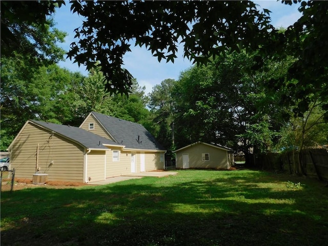 back of property with a lawn