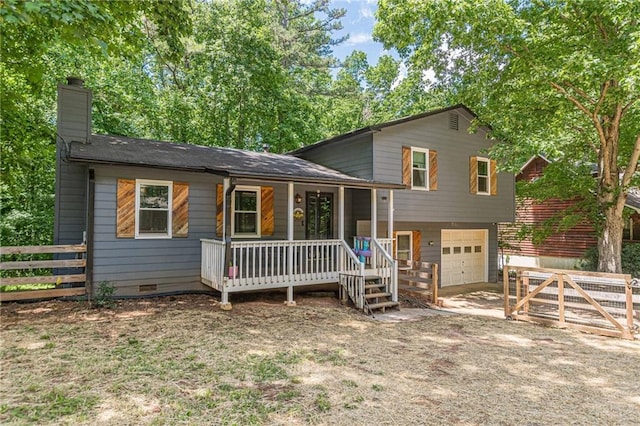 2642 Bridgehampton Rd SW, Marietta, GA 30064 - view of front of property featuring an attached garage, a chimney, covered porch, and driveway