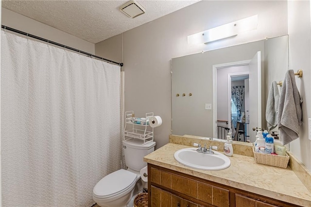 2642 Bridgehampton Rd SW, Marietta, GA 30064 - bathroom with toilet, vanity, a textured ceiling, and curtained shower
