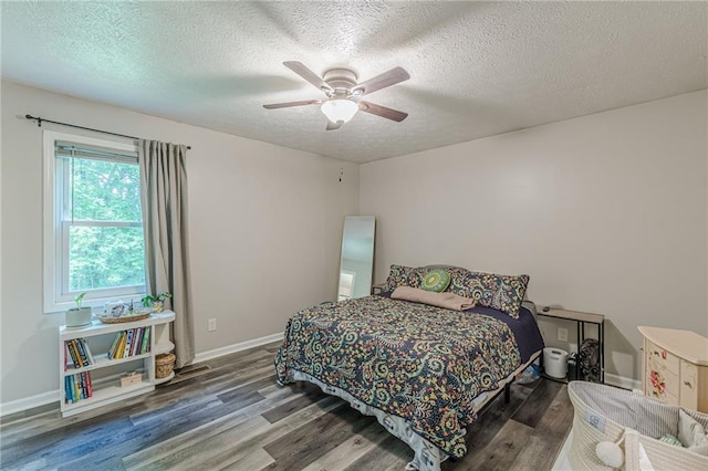 2642 Bridgehampton Rd SW, Marietta, GA 30064 - bedroom featuring wood finished floors, a textured ceiling, a ceiling fan, and baseboards