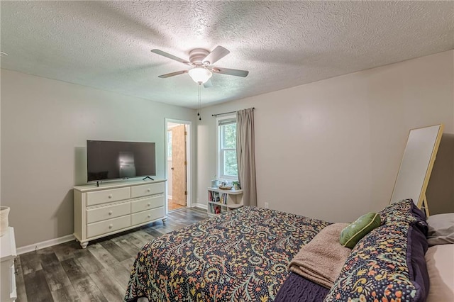 2642 Bridgehampton Rd SW, Marietta, GA 30064 - bedroom featuring wood finished floors, a textured ceiling, baseboards, and ceiling fan
