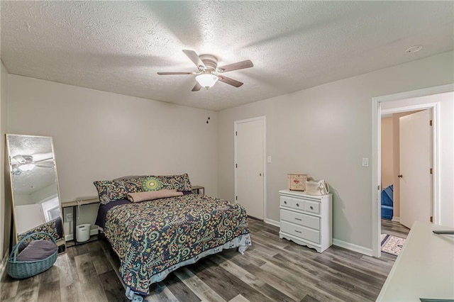 2642 Bridgehampton Rd SW, Marietta, GA 30064 - bedroom featuring wood finished floors, a textured ceiling, ceiling fan, and baseboards