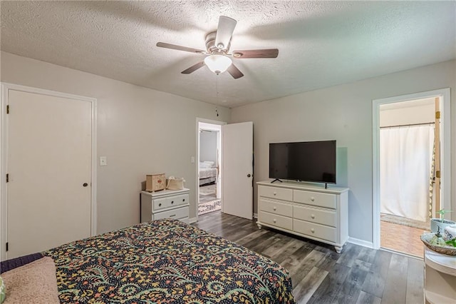 2642 Bridgehampton Rd SW, Marietta, GA 30064 - bedroom with dark wood-style flooring, a textured ceiling, ceiling fan, and baseboards