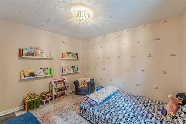 2642 Bridgehampton Rd SW, Marietta, GA 30064 - bedroom featuring a textured ceiling and baseboards