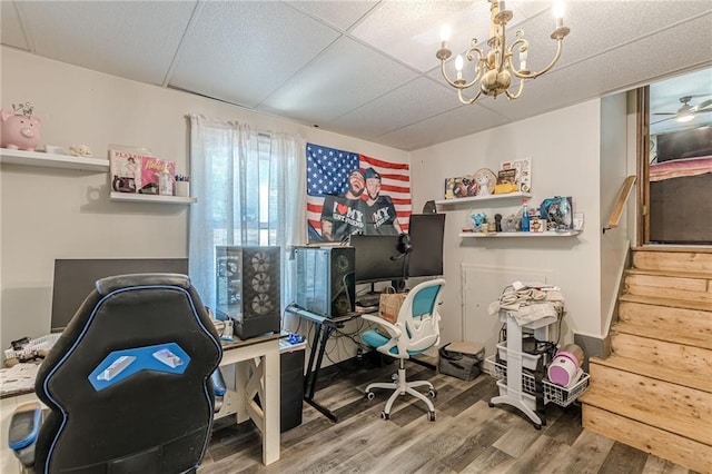 2642 Bridgehampton Rd SW, Marietta, GA 30064 - home office with wood finished floors, a chandelier, and a paneled ceiling