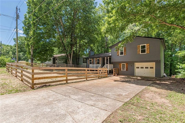 2642 Bridgehampton Rd SW, Marietta, GA 30064 - tri-level home featuring concrete driveway and a garage