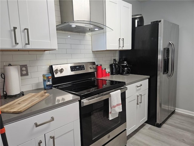 5536 Strathmoor Manor Cir, Lithonia, GA 30058 - kitchen with appliances with stainless steel finishes, range hood, light wood-type flooring, and white cabinets