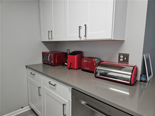 5536 Strathmoor Manor Cir, Lithonia, GA 30058 - kitchen featuring stainless steel dishwasher and white cabinets