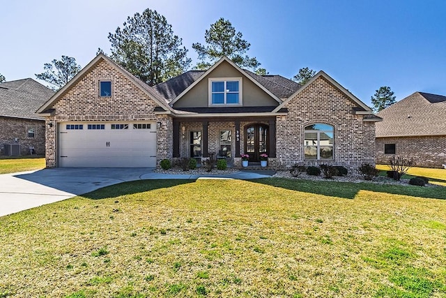 view of front of property featuring brick siding, driveway, an attached garage, and a front yard