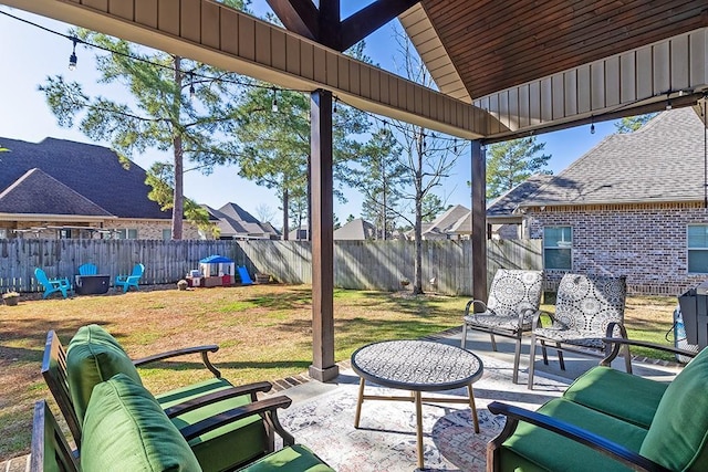 view of patio with an outdoor living space and a fenced backyard