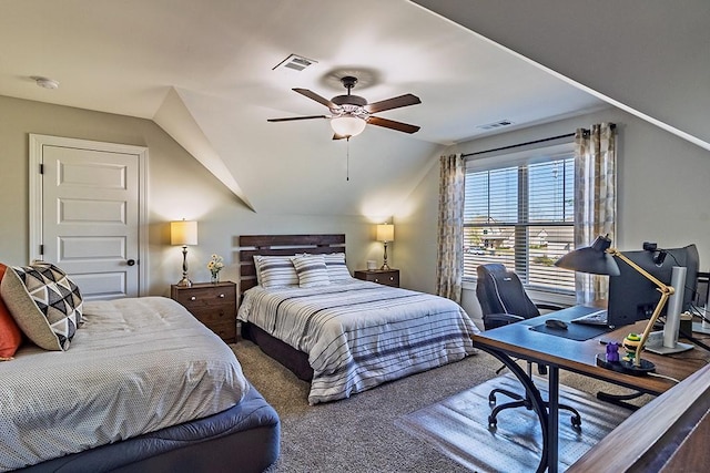 carpeted bedroom featuring vaulted ceiling, a ceiling fan, and visible vents