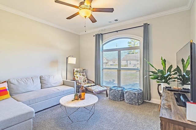 carpeted living room featuring visible vents, baseboards, ceiling fan, and ornamental molding