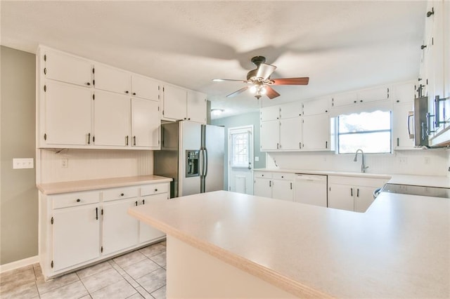 kitchen with white cabinetry, ceiling fan, light tile patterned floors, and appliances with stainless steel finishes