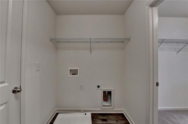 washroom featuring electric dryer hookup, washer hookup, carpet, baseboards, and laundry area