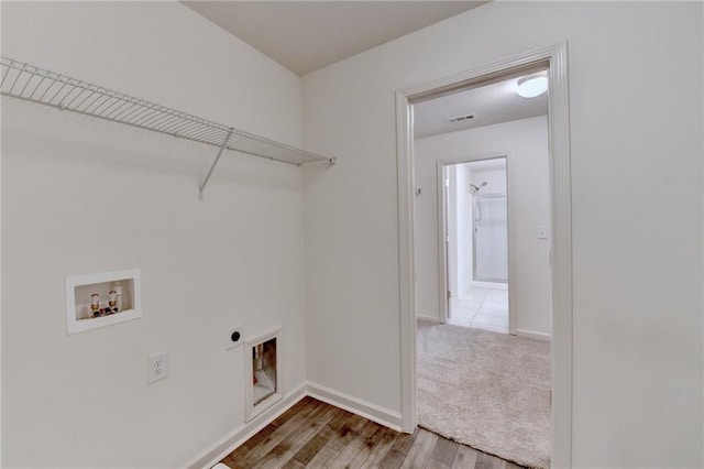 laundry room with visible vents, baseboards, laundry area, hookup for a washing machine, and hookup for an electric dryer