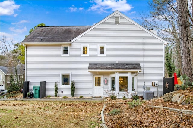 rear view of property featuring central AC