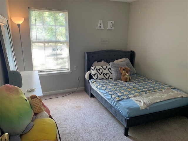 carpeted bedroom with baseboards