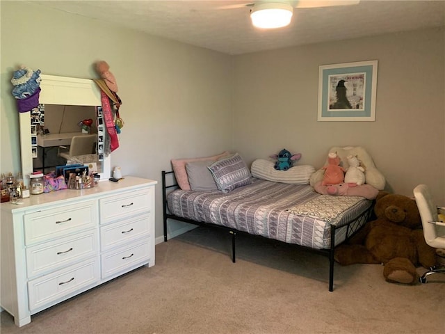bedroom featuring light carpet