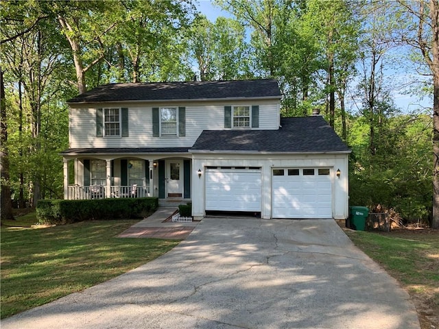 view of front facade featuring a porch, a front lawn, a garage, roof with shingles, and concrete driveway