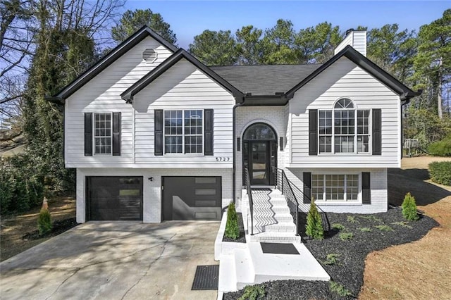 bi-level home featuring a garage