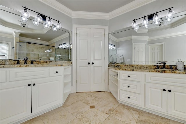 bathroom featuring tile flooring, ornamental molding, a raised ceiling, and large vanity