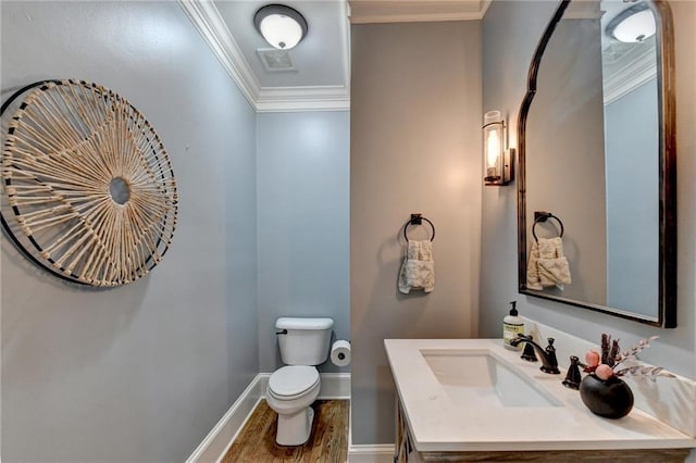 bathroom featuring ornamental molding, wood-type flooring, oversized vanity, and toilet