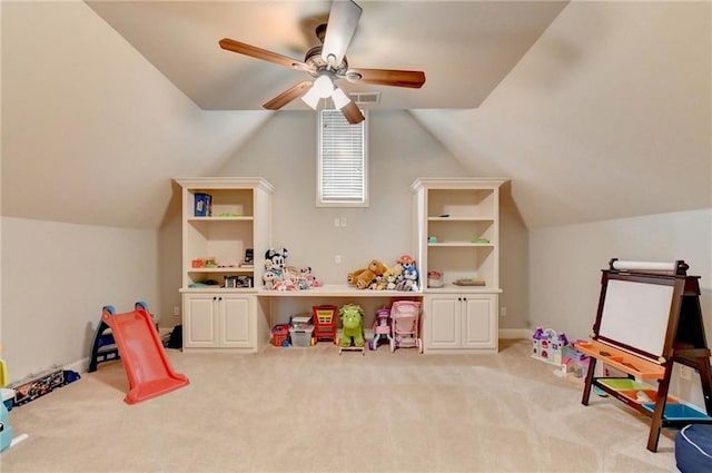 rec room with vaulted ceiling, ceiling fan, and carpet floors