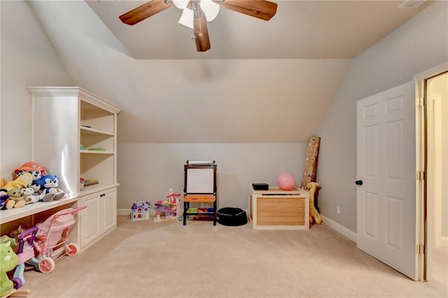 game room featuring vaulted ceiling, light carpet, and ceiling fan