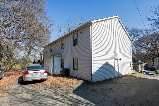 view of side of home featuring central AC unit