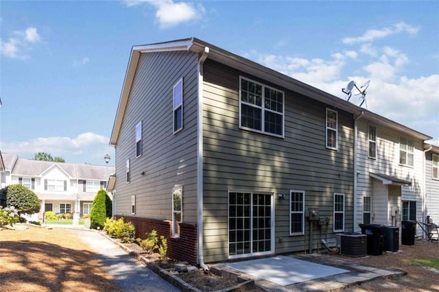 3170 Cedar Glade Ln, Buford, GA 30519 - view of side of home featuring a patio and a central AC unit