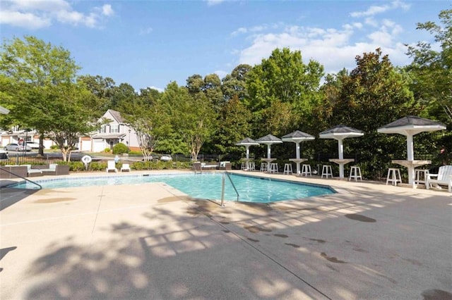3170 Cedar Glade Ln, Buford, GA 30519 - community pool with a patio area and view of scattered trees