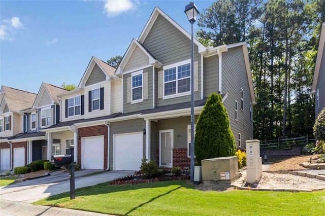 3170 Cedar Glade Ln, Buford, GA 30519 - townhome / multi-family property with concrete driveway, a garage, and brick siding