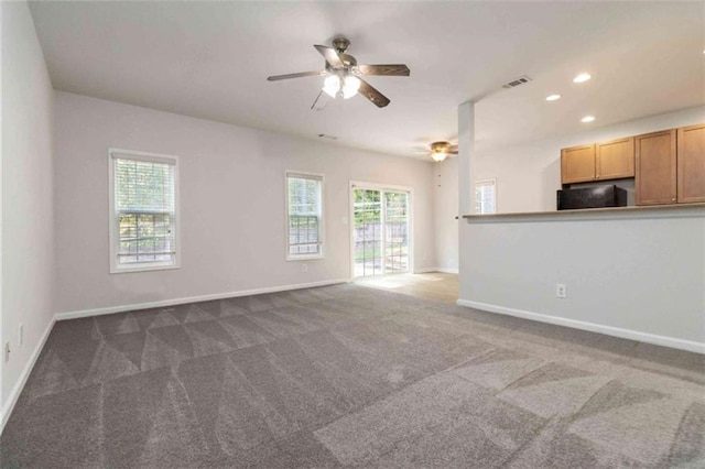 3170 Cedar Glade Ln, Buford, GA 30519 - unfurnished living room featuring a ceiling fan, plenty of natural light, carpet floors, and recessed lighting