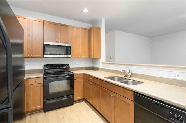 3170 Cedar Glade Ln, Buford, GA 30519 - kitchen featuring black appliances, light countertops, light wood finished floors, and recessed lighting