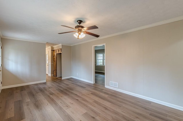 unfurnished room featuring crown molding, ceiling fan, and wood-type flooring