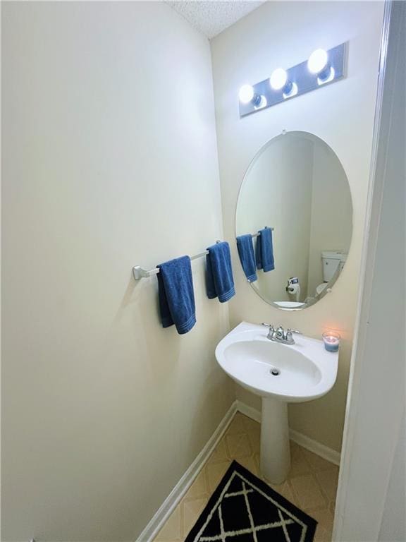 7104 Georges Way, Morrow, GA 30260 - half bathroom featuring a textured ceiling and baseboards
