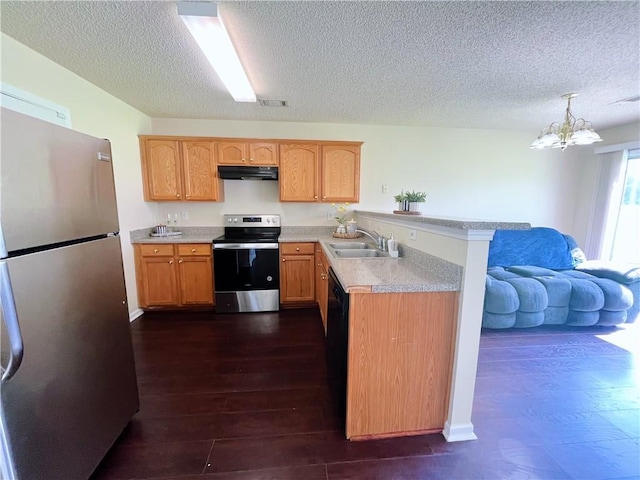 7104 Georges Way, Morrow, GA 30260 - kitchen featuring appliances with stainless steel finishes, under cabinet range hood, a peninsula, a textured ceiling, and light countertops