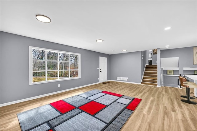 workout room featuring hardwood / wood-style flooring