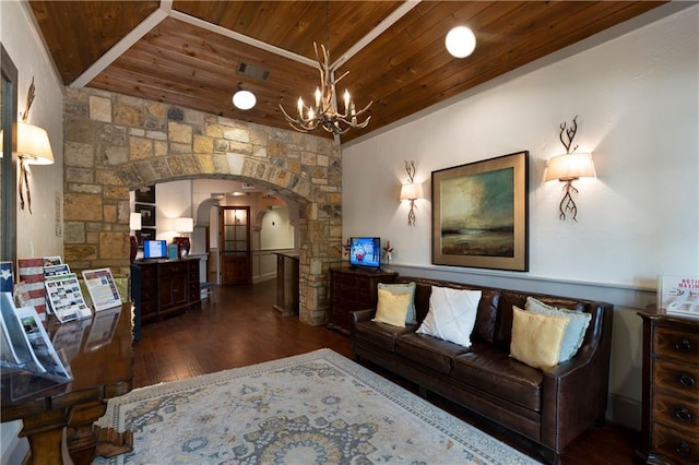 living room featuring visible vents, hardwood / wood-style floors, wooden ceiling, an inviting chandelier, and arched walkways